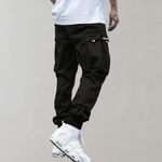 Tomáš – Pánské Cargo Joggingové Kalhoty – Fialové Streetwear Kalhoty s Kapsami na Zip a Náplety | | Elora Praha