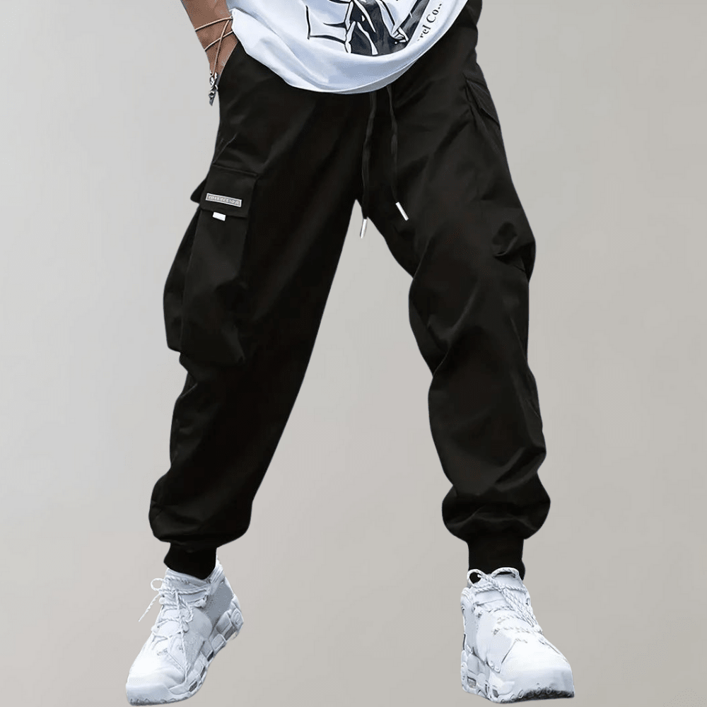Tomáš – Pánské Cargo Joggingové Kalhoty – Fialové Streetwear Kalhoty s Kapsami na Zip a Náplety | | Elora Praha