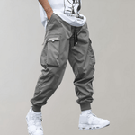 Tomáš – Pánské Cargo Joggingové Kalhoty – Fialové Streetwear Kalhoty s Kapsami na Zip a Náplety | | Elora Praha