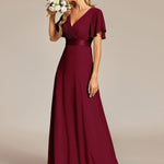 MONICA | Dlouhé šaty pro družičky s empírovým pasem a krátkými volánkovými rukávy | Bridesmaid Dresses | Elora Praha