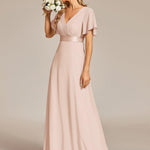 MONICA | Dlouhé šaty pro družičky s empírovým pasem a krátkými volánkovými rukávy | Bridesmaid Dresses | Elora Praha