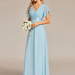 MONICA | Dlouhé šaty pro družičky s empírovým pasem a krátkými volánkovými rukávy | Bridesmaid Dresses | Elora Praha