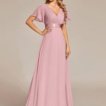 MONICA | Dlouhé šaty pro družičky s empírovým pasem a krátkými volánkovými rukávy | Bridesmaid Dresses | Elora Praha