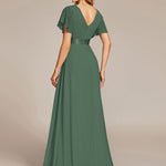 MONICA | Dlouhé šaty pro družičky s empírovým pasem a krátkými volánkovými rukávy | Bridesmaid Dresses | Elora Praha