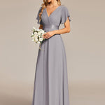 MONICA | Dlouhé šaty pro družičky s empírovým pasem a krátkými volánkovými rukávy | Bridesmaid Dresses | Elora Praha