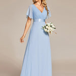 MONICA | Dlouhé šaty pro družičky s empírovým pasem a krátkými volánkovými rukávy | Bridesmaid Dresses | Elora Praha