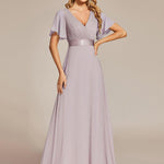 MONICA | Dlouhé šaty pro družičky s empírovým pasem a krátkými volánkovými rukávy | Bridesmaid Dresses | Elora Praha