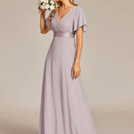 MONICA | Dlouhé šaty pro družičky s empírovým pasem a krátkými volánkovými rukávy | Bridesmaid Dresses | Elora Praha