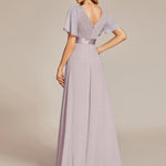 MONICA | Dlouhé šaty pro družičky s empírovým pasem a krátkými volánkovými rukávy | Bridesmaid Dresses | Elora Praha