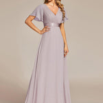 MONICA | Dlouhé šaty pro družičky s empírovým pasem a krátkými volánkovými rukávy | Bridesmaid Dresses | Elora Praha