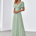 MONICA | Dlouhé šaty pro družičky s empírovým pasem a krátkými volánkovými rukávy | Bridesmaid Dresses | Elora Praha