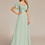 MONICA | Dlouhé šaty pro družičky s empírovým pasem a krátkými volánkovými rukávy | Bridesmaid Dresses | Elora Praha