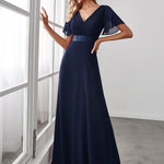 MONICA | Dlouhé šaty pro družičky s empírovým pasem a krátkými volánkovými rukávy | Bridesmaid Dresses | Elora Praha