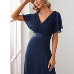 MONICA | Dlouhé šaty pro družičky s empírovým pasem a krátkými volánkovými rukávy | Bridesmaid Dresses | Elora Praha