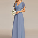 MONICA | Dlouhé šaty pro družičky s empírovým pasem a krátkými volánkovými rukávy | Bridesmaid Dresses | Elora Praha
