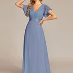 MONICA | Dlouhé šaty pro družičky s empírovým pasem a krátkými volánkovými rukávy | Bridesmaid Dresses | Elora Praha