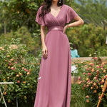 MONICA | Dlouhé šaty pro družičky s empírovým pasem a krátkými volánkovými rukávy | Bridesmaid Dresses | Elora Praha