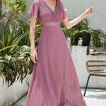 MONICA | Dlouhé šaty pro družičky s empírovým pasem a krátkými volánkovými rukávy | Bridesmaid Dresses | Elora Praha