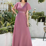 MONICA | Dlouhé šaty pro družičky s empírovým pasem a krátkými volánkovými rukávy | Bridesmaid Dresses | Elora Praha